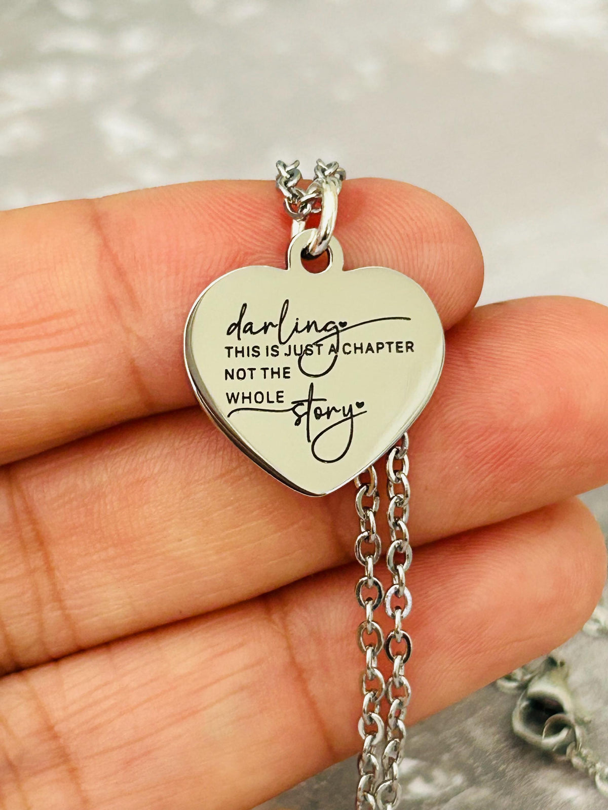 Motivational Stainless Steel Heart Necklace: 'Just A Chapter' Engraved Pendant