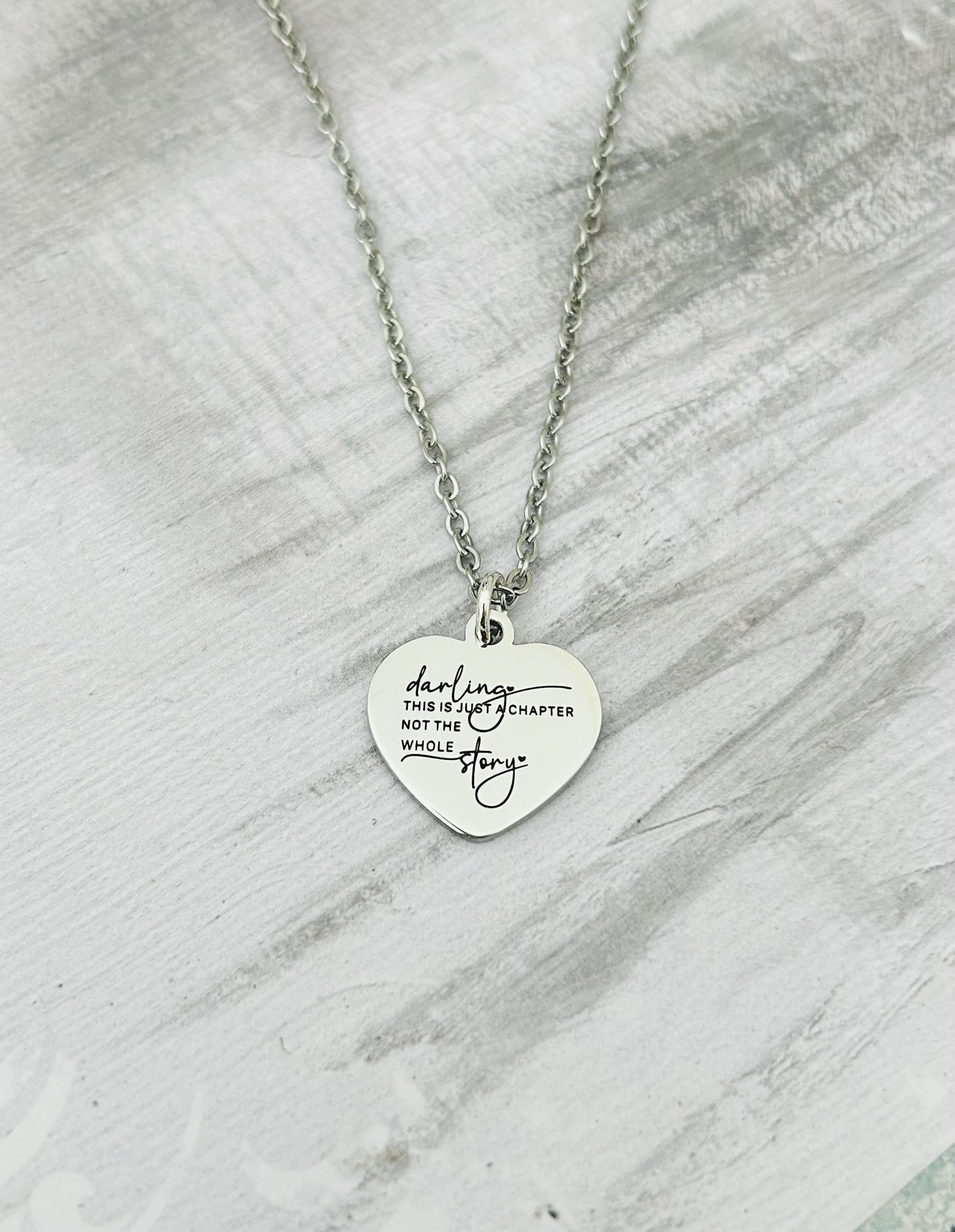 Motivational Stainless Steel Heart Necklace: 'Just A Chapter' Engraved Pendant