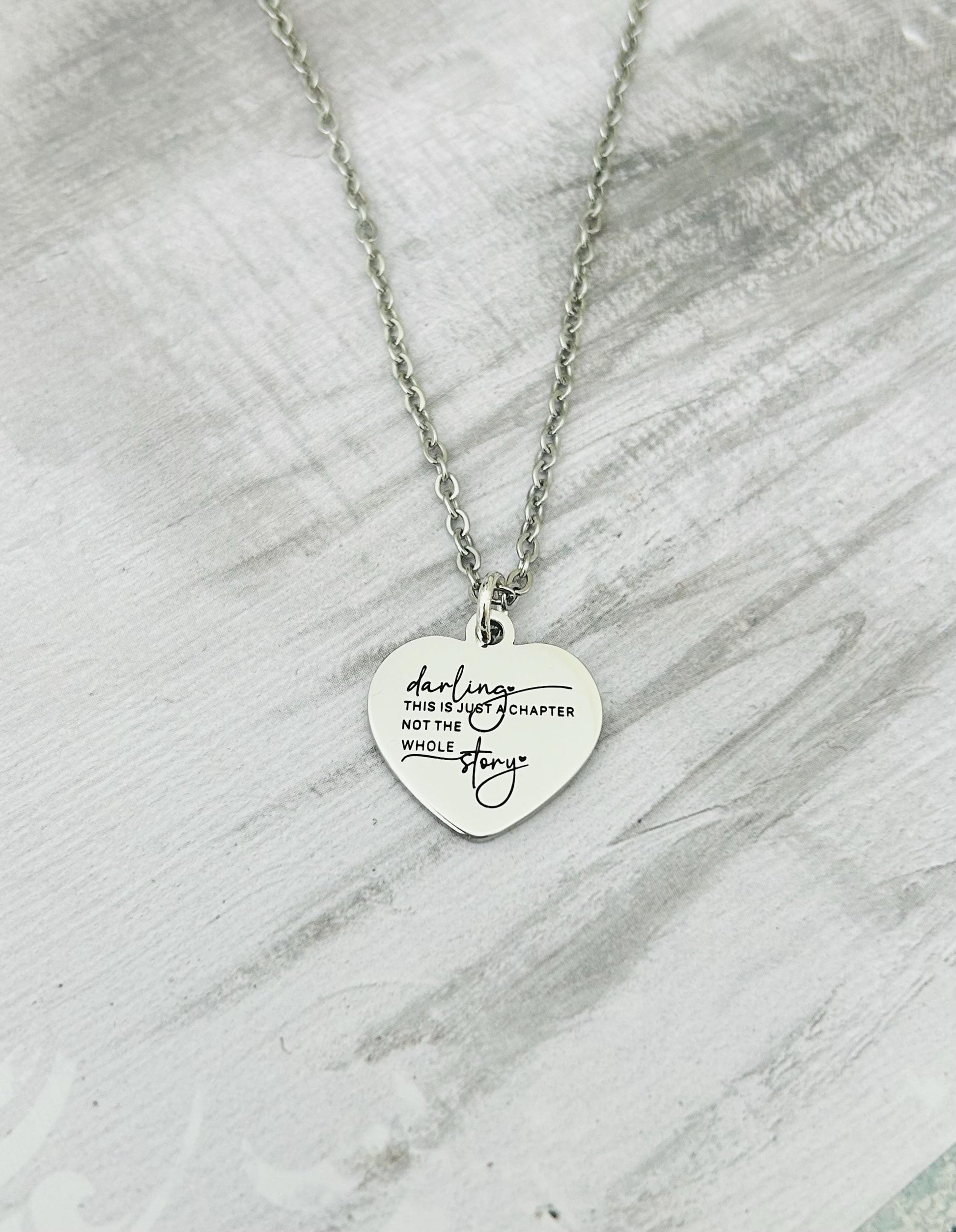 Motivational Stainless Steel Heart Necklace: 'Just A Chapter' Engraved Pendant