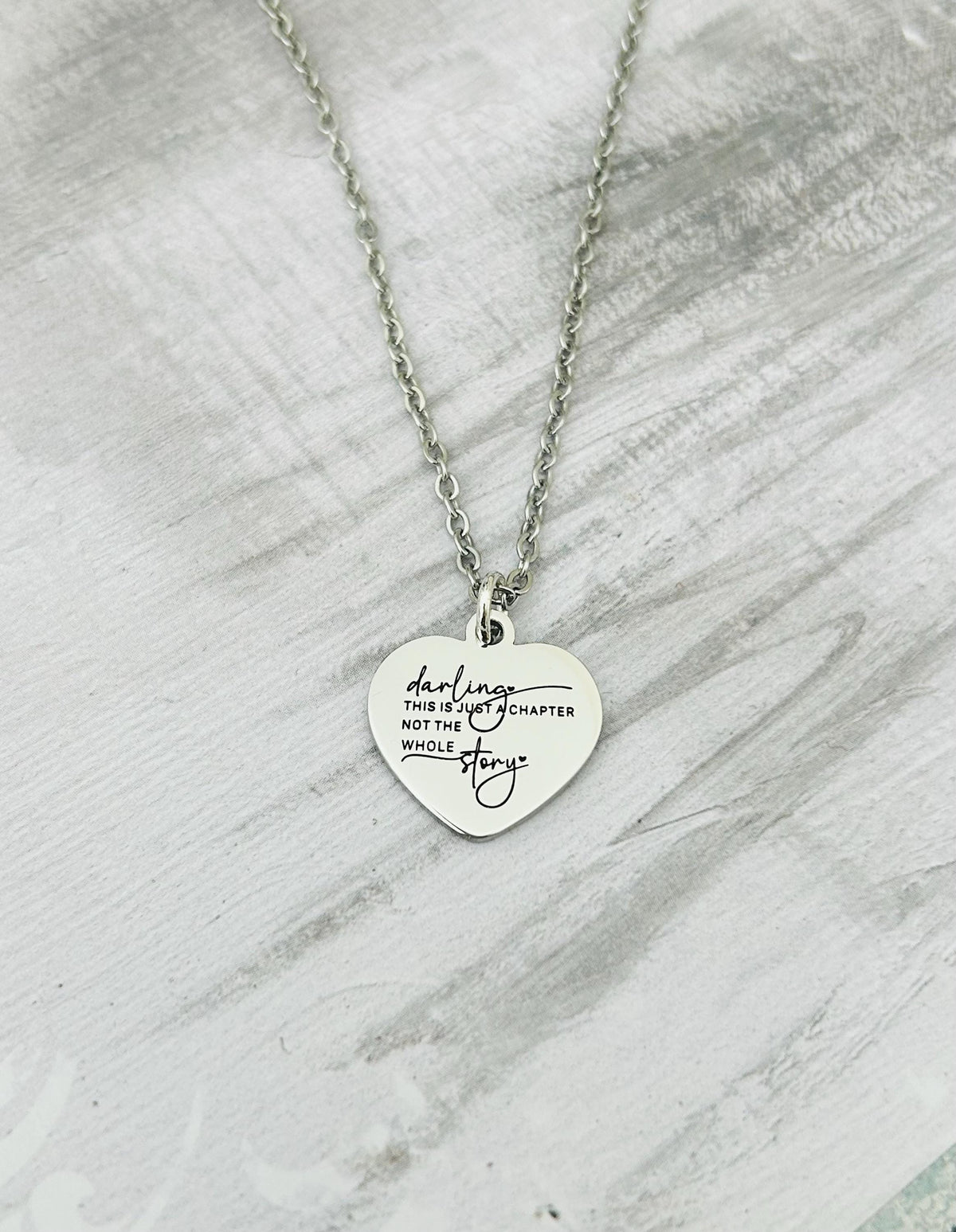 Motivational Stainless Steel Heart Necklace: 'Just A Chapter' Engraved Pendant