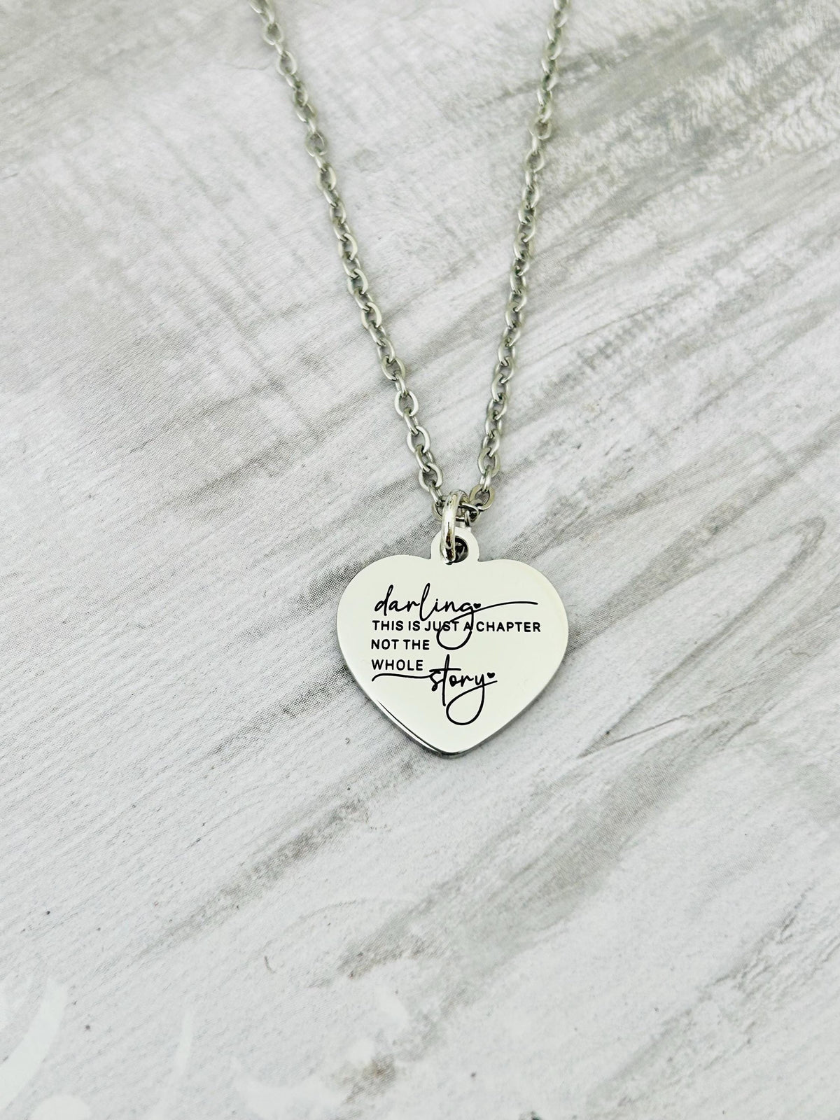 Motivational Stainless Steel Heart Necklace: 'Just A Chapter' Engraved Pendant