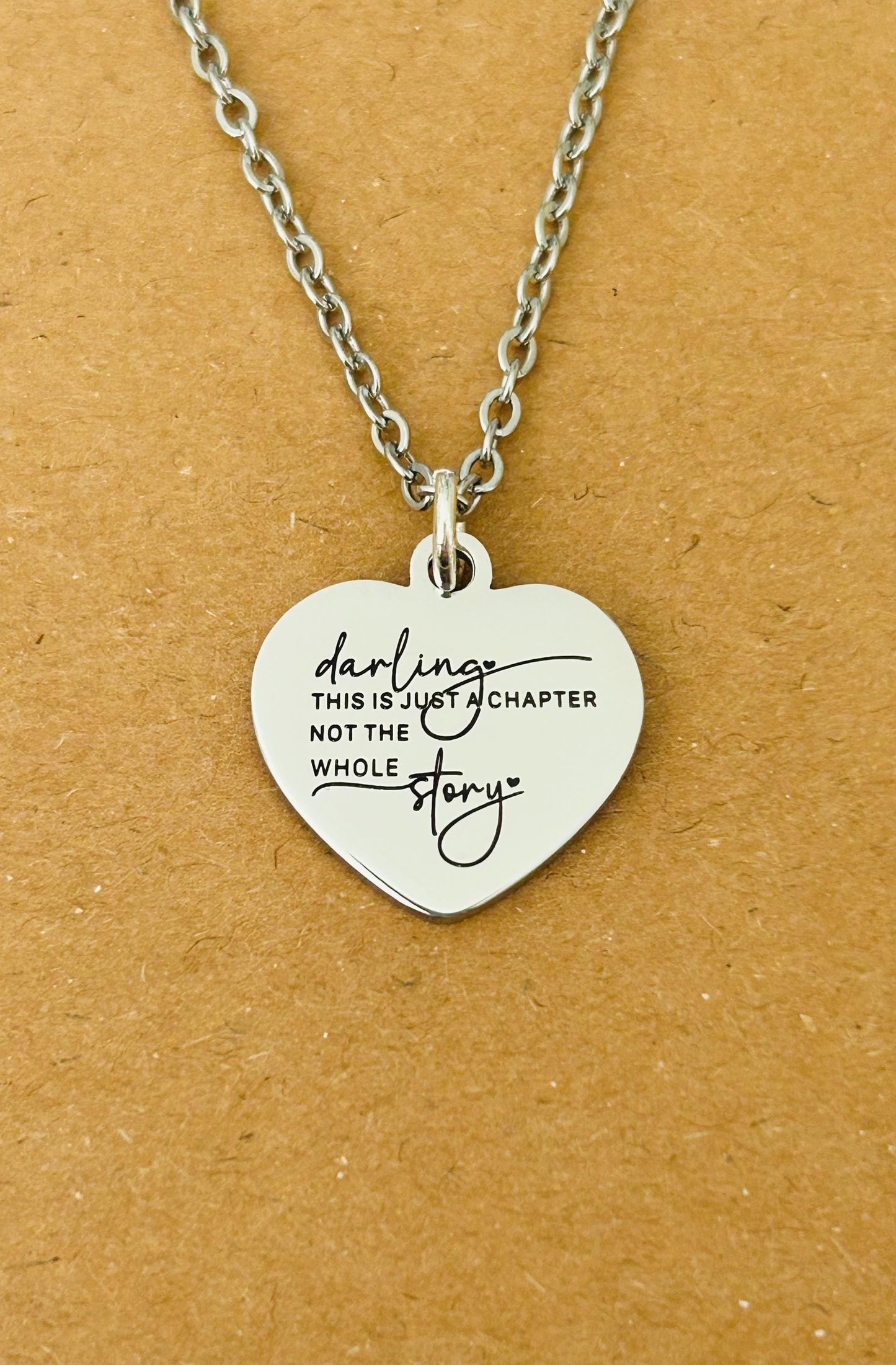 Motivational Stainless Steel Heart Necklace: 'Just A Chapter' Engraved Pendant