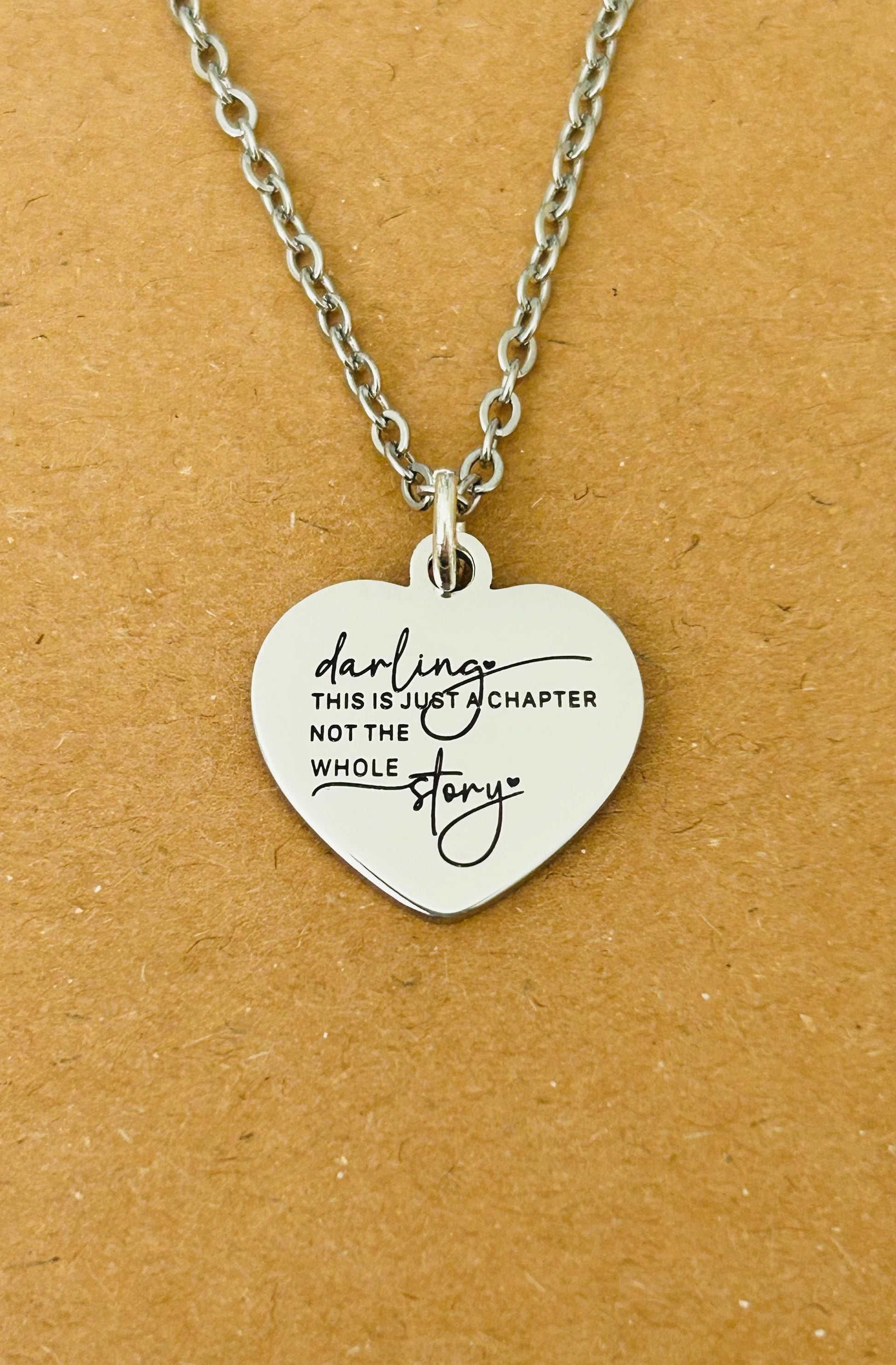 Motivational Stainless Steel Heart Necklace: 'Just A Chapter' Engraved Pendant