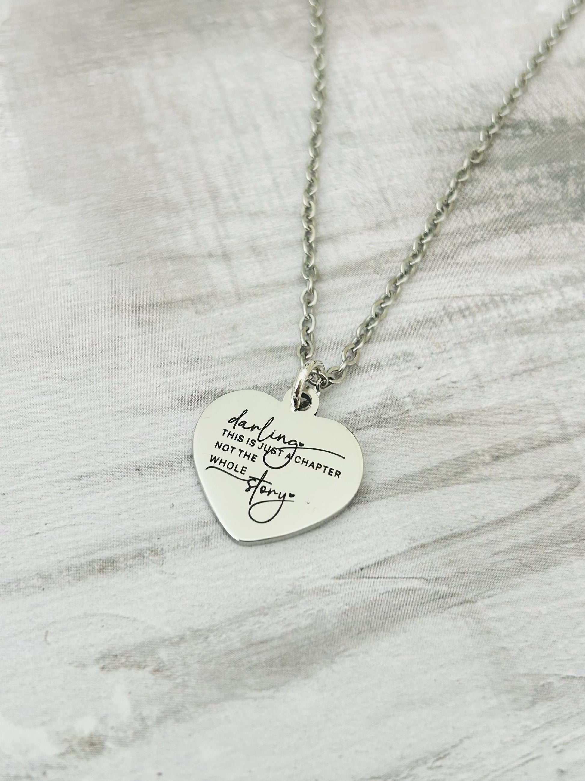 Motivational Stainless Steel Heart Necklace: 'Just A Chapter' Engraved Pendant
