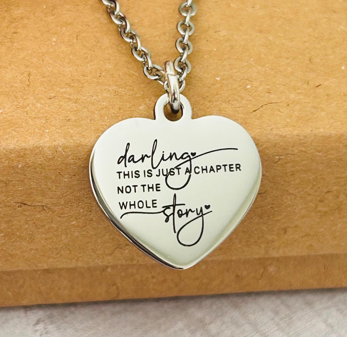 Motivational Stainless Steel Heart Necklace: 'Just A Chapter' Engraved Pendant