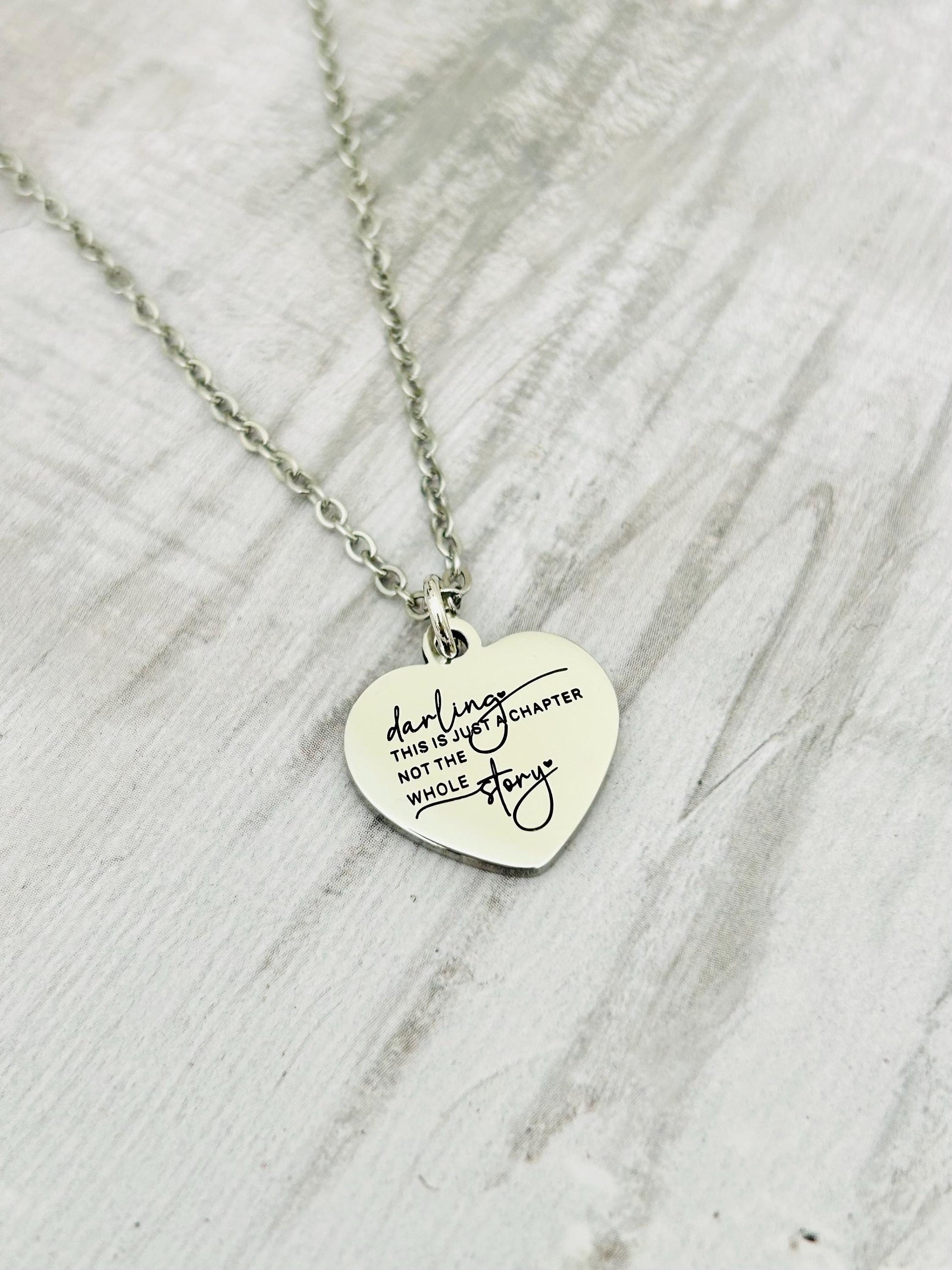 Motivational Stainless Steel Heart Necklace: 'Just A Chapter' Engraved Pendant
