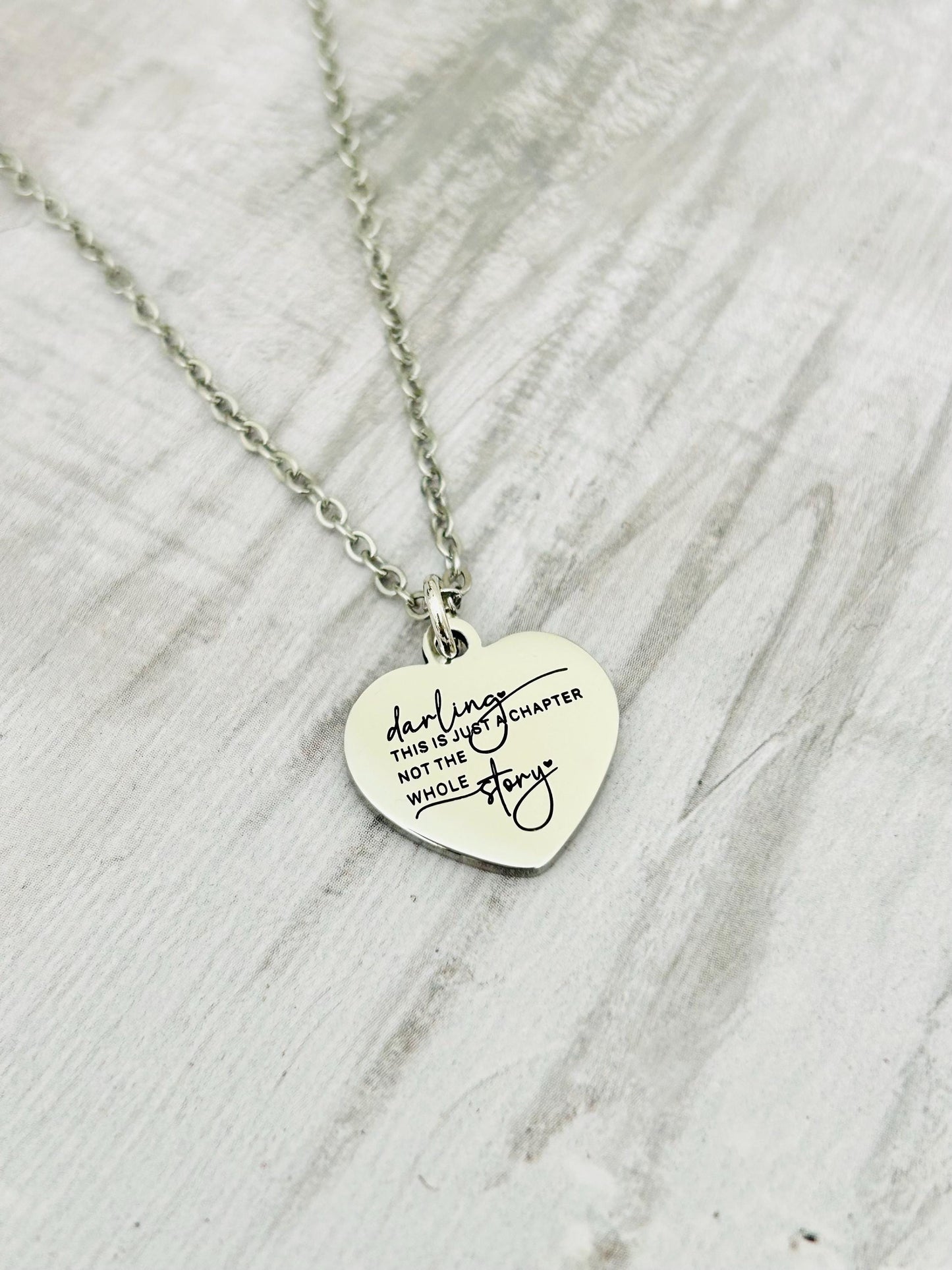 Motivational Stainless Steel Heart Necklace: 'Just A Chapter' Engraved Pendant