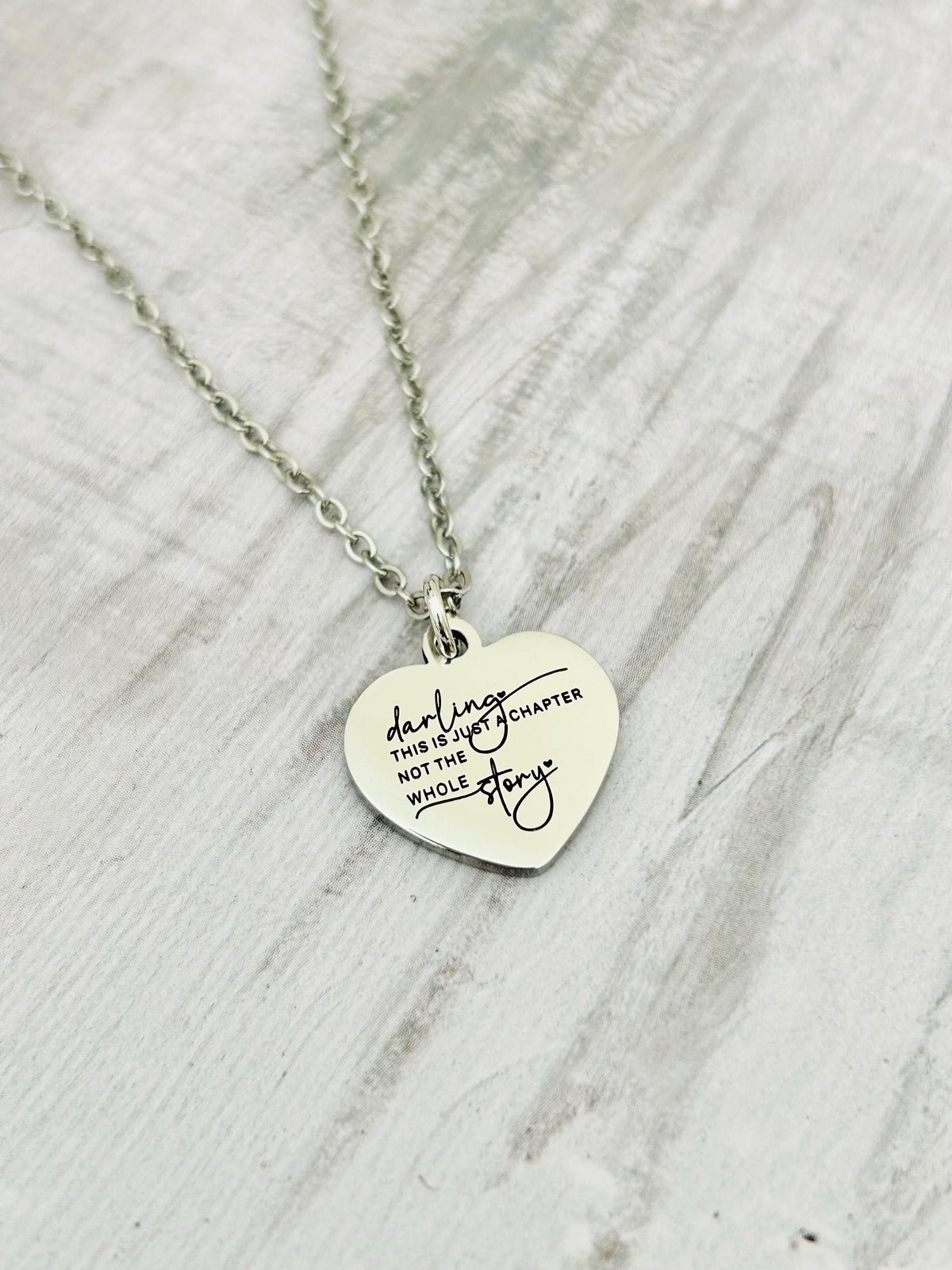 Motivational Stainless Steel Heart Necklace: 'Just A Chapter' Engraved Pendant